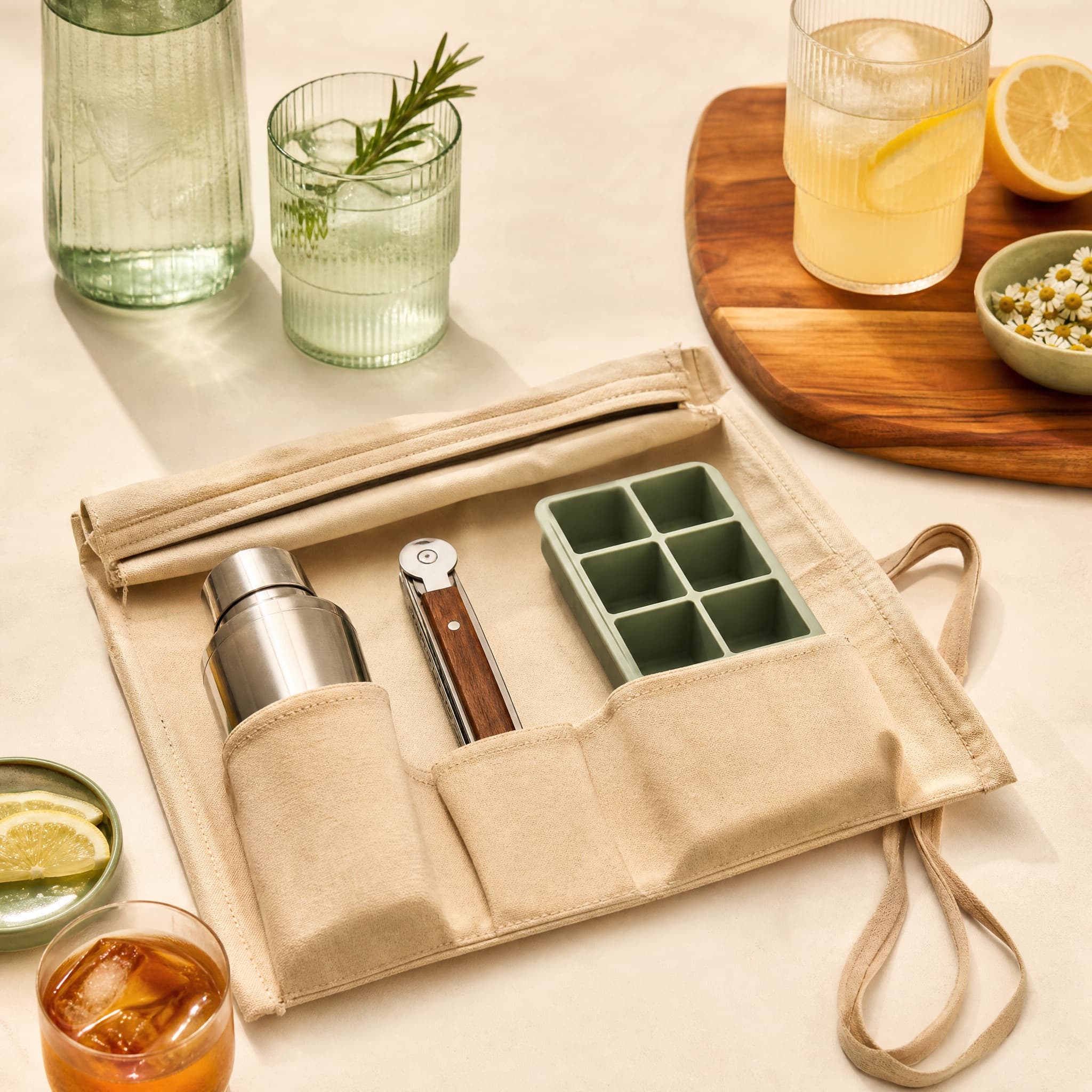 Travel Hosting Roll arranged on a warm cream surface